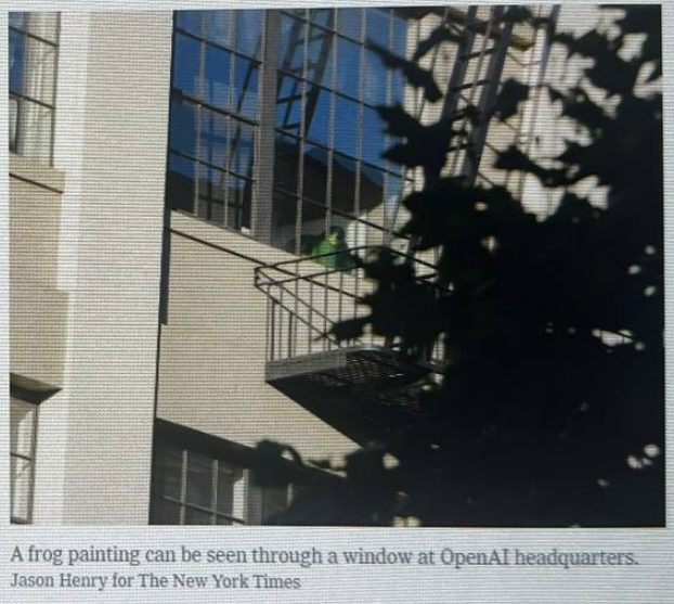 A frog painting visible through a window at OpenAI headquarters, seen from a fire escape.